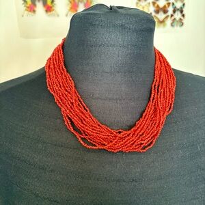 Multi strand red/orange beaded necklace